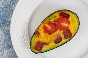 Baked Avocado with Eggs Cherry Tomato and Sausages