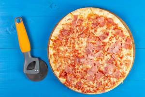 Baked Pizza with Ham and pizza round knife