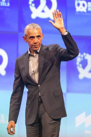 Barack Obama waves goodbye on stage at founders conference Bits & Pretzels in Munich