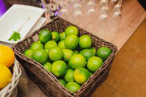 Basket Of Limes On The Table