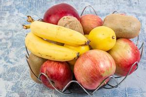 Basket with Bananas Apples Kiwi and Lemon