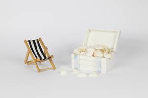 Beach chair with box full of seashells