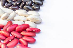 Beans of different varieties on a white background