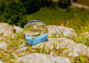 Beautiful blue sky reflected in glass ball