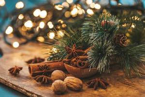 Beautiful Christmas background with spices and blurred glow garland (Flip 2019)