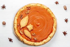 Beautiful pumpkin pie and star anise. Top view