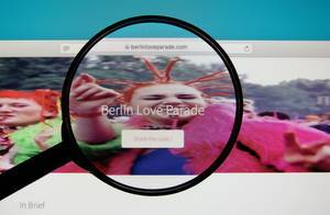 Berlin Love Parade website on a computer screen with a magnifying glass.jpg