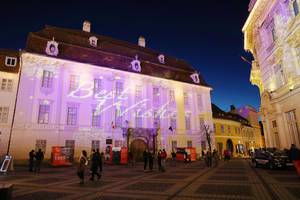 Best Wishes message, light reflection on buildings for Christmas holidays, Sibiu