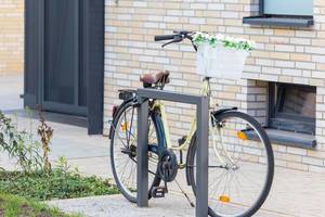 Bicycle with flower decoration parked at a residential area