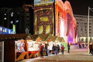 Big outdoor stage and small huts at Bucharest Christmas market