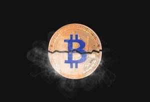 Bitcoin broken in half with smoke