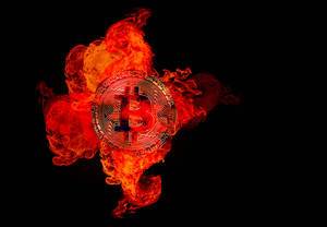 Bitcoin cryptocurrency burning in fire