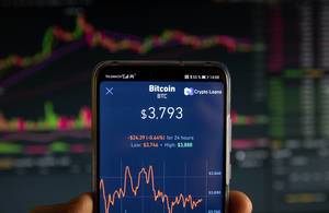 Bitcoin market value is seen on mobile device