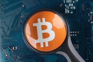 Bitcoin ogo over electronic circuit board background