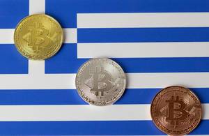 Bitcoins auf griechischer Flagge