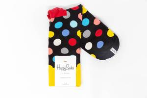 Black cotton socks with colorful dots on white background