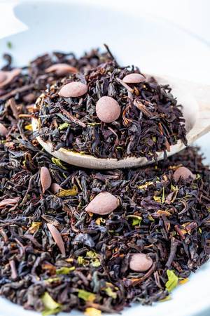 Black dry tea with petals and chocolate pieces
