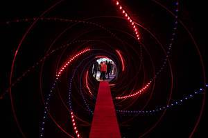Black tunnel with red light lights