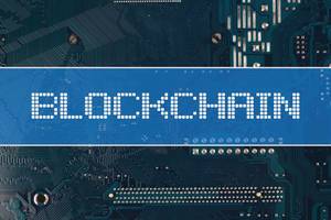 Blockchain text over electronic circuit board background