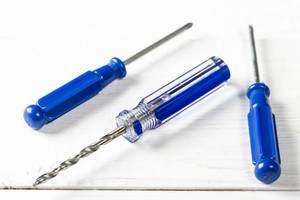 Blue handled screwdrivers on white background