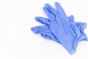 Blue Medicine Gloves isolated above white background with copy space