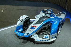 Blue-white electric racing car by BMW for Formel-E motor sports