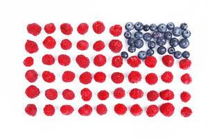 Blueberries and raspberries in USA flag shape, white background (Flip 2019)