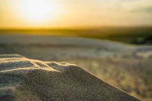 Bokeh of Sand with a Sunset in the Background in Mui Ne