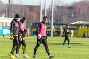 Borussia Dortmund players Marwin Hitz, Manuel Akanji and Mats Hummels at the end of their training on a sunny day