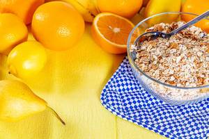 Bowl of Breakfast cereals with citrus fruits