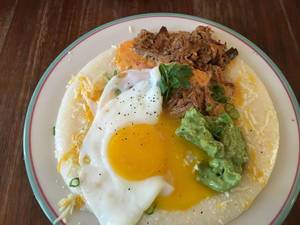 Breakfast: Avocado creme, Pulled Pork and Fried Egg