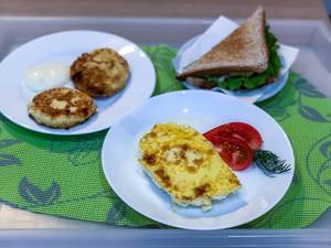 Breakfast: Sandwich, eggs and Russian pancakes