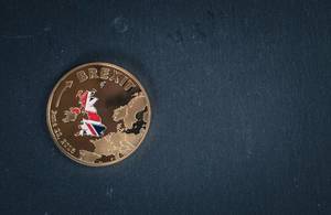 Brexit coin on a black background