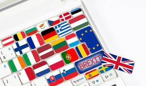 Brexit text and international flags on computer keyboard