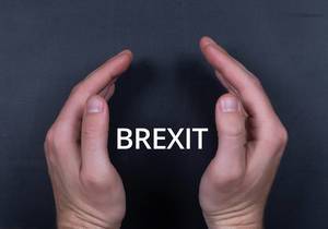 Brexit text with man hands on black bacground
