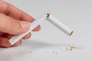 Broken cigarette on white background. World no tobacco day and lung health concept