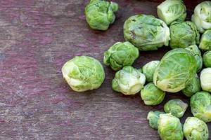 Brussels sprouts on old wooden background (Flip 2019)