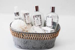 Bubble Bath and Lotion Bottles on a Grey Basket