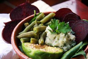 Buddha Bowl with mashed potatoes, parley, beets, avocado and green beans