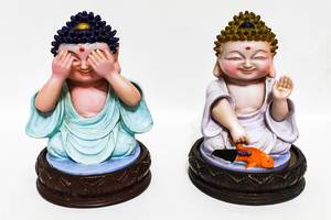 Buddha figurines isolated on white surface