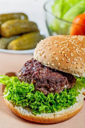 Burger with a large cutlet and lettuce
