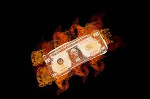 Burning dollar banknote