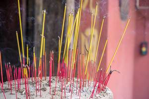 Burning Incense Sticks in a Sand filled Pot in Jade Emperor Pagoda in Saigon