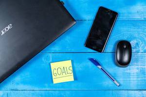 Business Goals concept with Lap Top and Mobile phone
