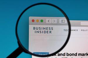 Business Insider logo under magnifying glass