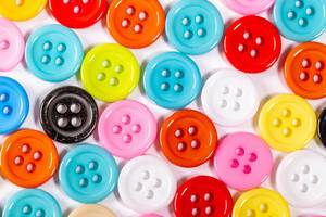 Buttons of different colors on white background