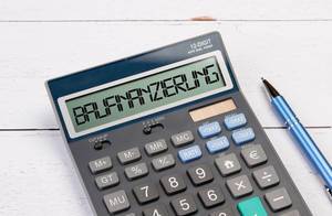 Calculator with the word Baufinanzierung on the display