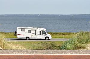 Campervan on tour at the windy coastline