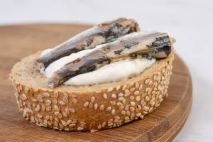 Canned Sardines Fish sandwich on the wooden board (Flip 2019)