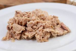 Canned Tuna Fish served on the white plate (Flip 2019)